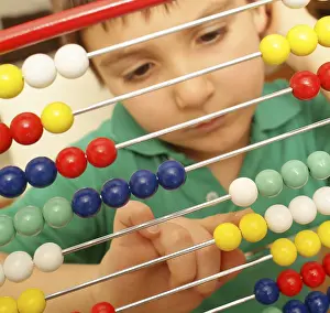 Education Model Prints: School boy with abacus