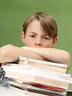 Schoolboy With Books Prints: Schoolboy with a stack of books