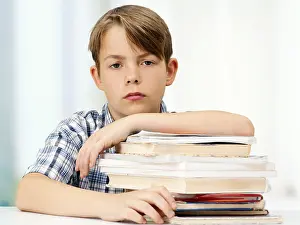 Caucasion Ethnicity Head Shot Prints: Schoolboy with a stack of books, looking serious