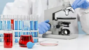 Female Scientist In Lab Prints: Scientist checking substance with microscope