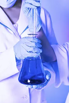 Scientist Experiment Prints: Scientist shows a diffusion in the flask