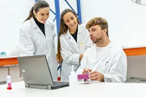 Healthcare System Information Prints: Scientist team using laptop to analysis data of a research study