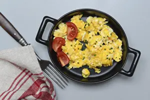Scrambled Eggs Recipe Prints: Scrambled eggs with tomatoes in a pan