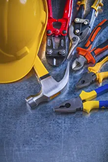 Construction Industry Symbol Prints: Scratched metallic background with variation of construction tools maintenance concept