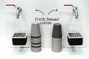 Benelux Countries Cuisine Prints: A setup of two coffee taps with stacks of cups