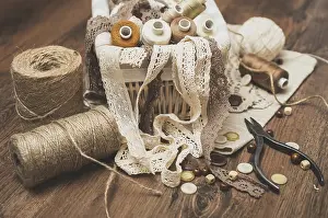 Sewing Concept Prints: Sewing concept. Thread spools, buttons and sewing needles