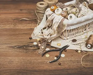Handicraft Equipment Prints: Sewing concept. Thread spools, buttons and sewing needles