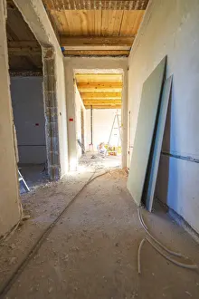 Construction Site Interior Prints: A shell with sunlight in the corridor