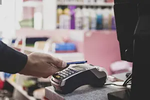 Online Shopping Payment Prints: Shopper does payment using smartphone