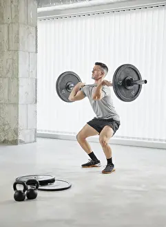Fitness Exercise Prints: Full shot man working out with weights
