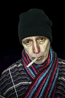 Dark Background Images Prints: Sick man with the flu and temperature