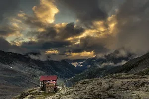 Evening Sun In The Alps Prints: Siegerlandhutte at sunset with dramatic cloudy sky