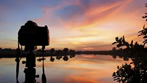 Lake Reflection Photography Prints: Silhouette of a camera at sunset