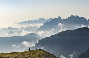 Southern Limestone Alps Photography Prints: Silhouettes of mountains with small clouds in between