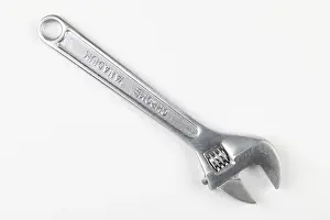 Adjustable Wrench Prints: A silver adjustable wrench on a white background