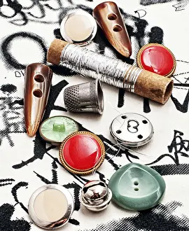 Sewing Shop Decor Prints: Silver bobbin of thread and a set of buttons