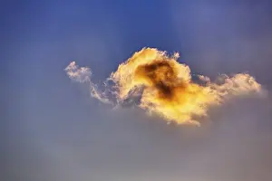 Blue Evening Sky Germany Prints: Single source cloud, illuminated by the evening sun
