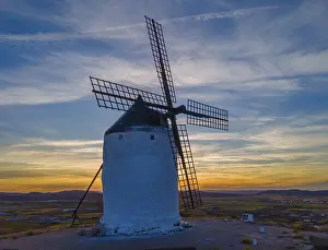 Windmill At Sunset Prints: Single windmill against a dramatic sunset