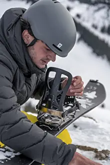 Snowy Mountain Range Bavaria Prints: Ski tourers, man assembles his splitboard