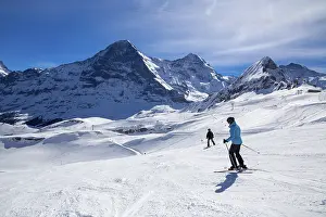 Skiing In Switzerland Prints: Skiing against the backdrop of the north face of the Eiger in Grindelwald