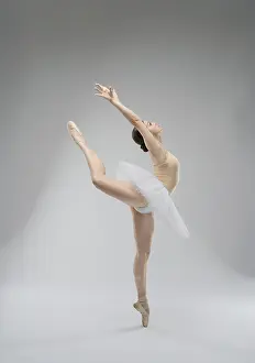 Ballet Dancer Prints: A skilled ballet dancer gracefully leaps in a studio