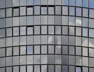 Prints of The sky is reflected in a modern, semi-circular glass facade, Tempelhof-Schoneberg district, Berlin, Germany The sky is reflected in a modern, semi-circular glass faade, Tempelhof-Schneberg district Berlin Architecture Prints: The Sky Reflected in Modern Glass Facade Print