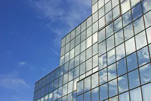 Highrise Construction Photography Prints: Sky and skyscraper building with reflection of sky and clouds