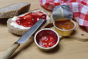 Aluminum Packaging Waste Prints: Slice of bread with jam and jam in portion pack