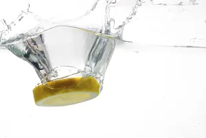 Food Photography Studio Still Life Prints: Slice of lemon falling into the water