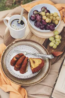 Fresh Fruit And Vegetable Display Prints: A slice of pumpkin cake is artfully plated with a fork on a rustic dish