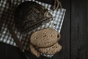 Wholemeal Bread Prints: Sliced bread on a rustic wooden table
