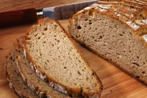 Empty Table Setting Prints: Several slices of dark bread lying next to each other