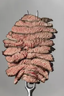 Steak Slices Prints: Slices of steak on a grey background