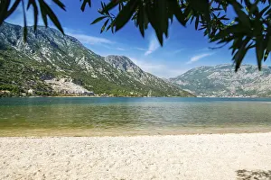 Prints of Small cozy beach in the village Morinj in the Kotor bay, Montenegro Montenegro Prints: Small Cozy Beach in Morinj, Kotor Bay Print