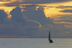 Cloudy Weather Conditions Prints: Small sailing boat in front of thunderclouds