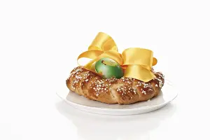 Easter Dessert Prints: Small savarin with Easter egg and bow on a plate