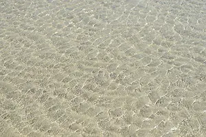 Northern Germany Nature Prints: Small waves on sandy beach with light reflections