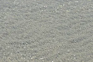 North Sea Beach Prints: Small waves on sandy beach with light reflections