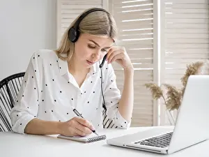 Female Office Worker Prints: Smart young student thinking her notes
