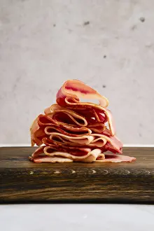 Smoked Bacon Prints: Smoked bacon pieces stacked in a stack
