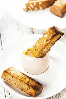 Dairy Product Meals Prints: The soft-boiled egg in an eggcup with toasted bread