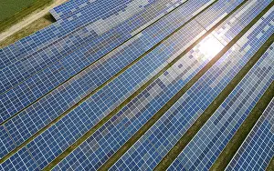 Alternative Power Generation Prints: Solar panel field at work with sun reflection