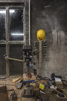 Northern Germany Scenes Prints: Spanner and construction helmet on the wall of a workshop