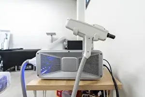 Healthcare System Technology Prints: Specialized laser device operating in a clinic setting