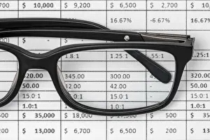 Empty Office Space Photo Prints: Detail of a spreadsheet and glasses on the table in the office
