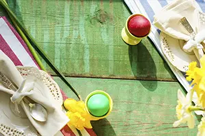 Wooden Board Decor Prints: Spring festive easter dining table setting with yellow daffodil flowers