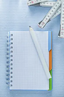 Plain Background Studio Photo Prints: Squared notepad pencil measuring tape construction concept