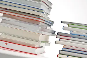 Plain Colored Background Photo Prints: Stack of books. Released and isolated in front of a white background Austria