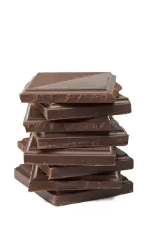 Close Up Shot Prints: Stack of dark chocolate isolated on white