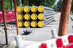 Alternative Energy Solutions Prints: A stack of district heating pipes on a construction site in Dusseldorf